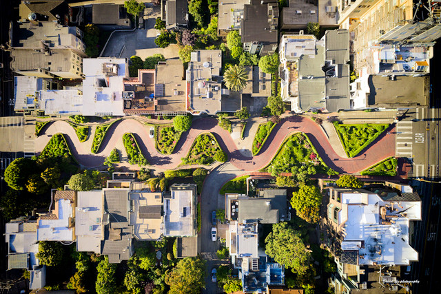 Stop at Lombard Street to watch as bikes and cars navigate the world’s most crooked street.